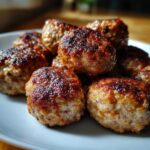 Close-up of a pile of juicy turkey meatballs, perfectly browned and ready to serve.